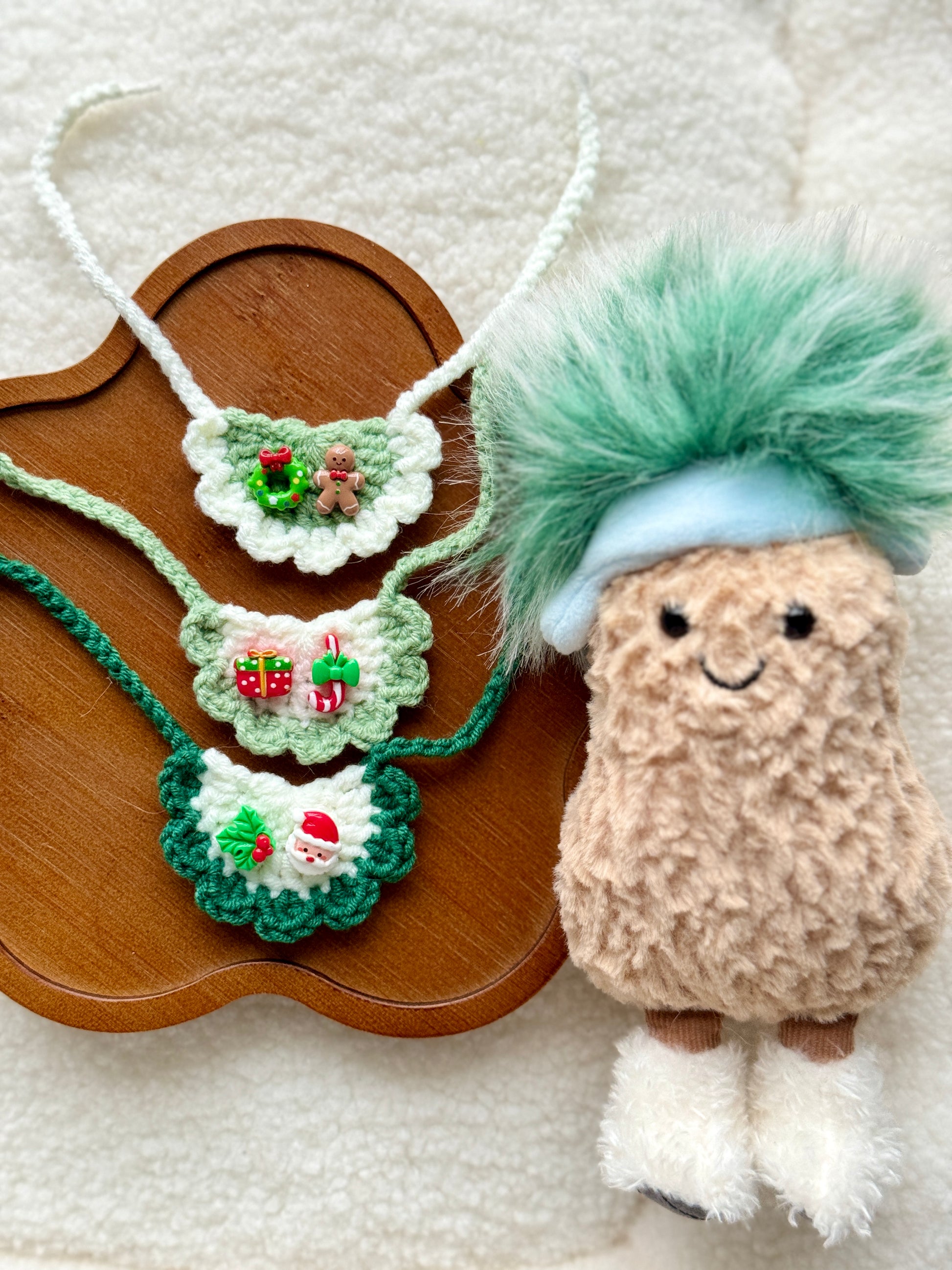 Handmade green Christmas crochet bib collars for Jellycat plush with gingerbread, gift and Santa charms