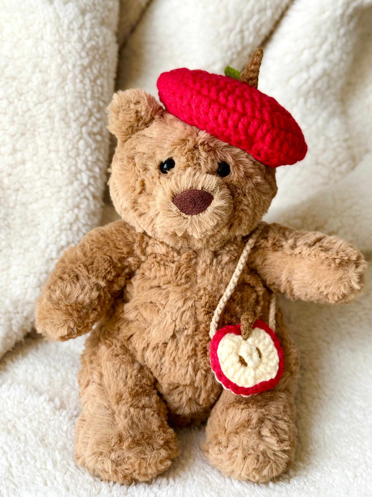 Jellycat bear wearing handmade crochet apple hat and apple slice crossbody bag