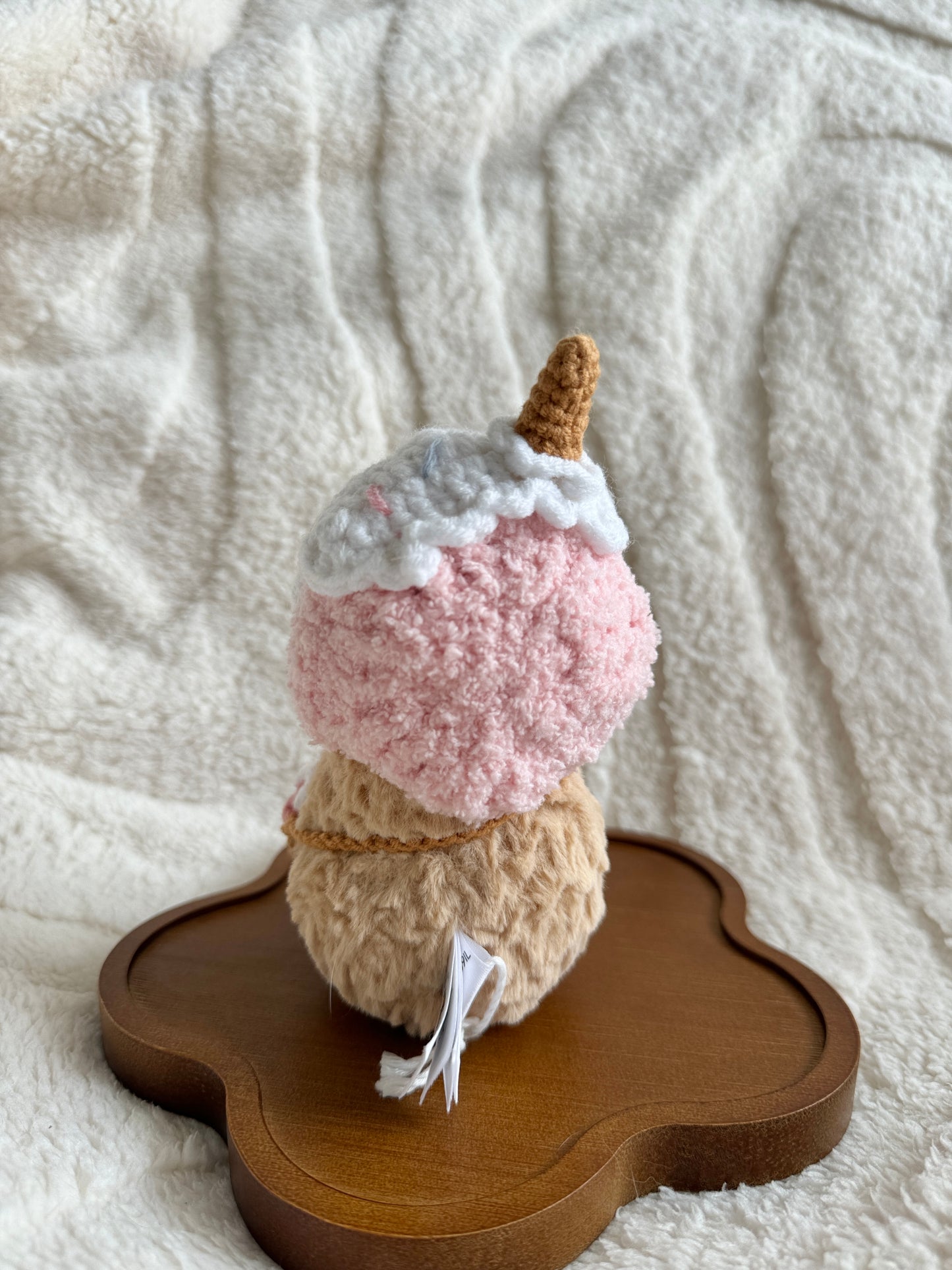 Rear view of the plush with ice cream cone hat and full back of bag visible.