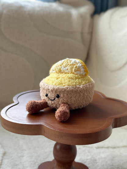 Side angle showing the plush's fluffy texture and 3D crocheted lemon slice on top.