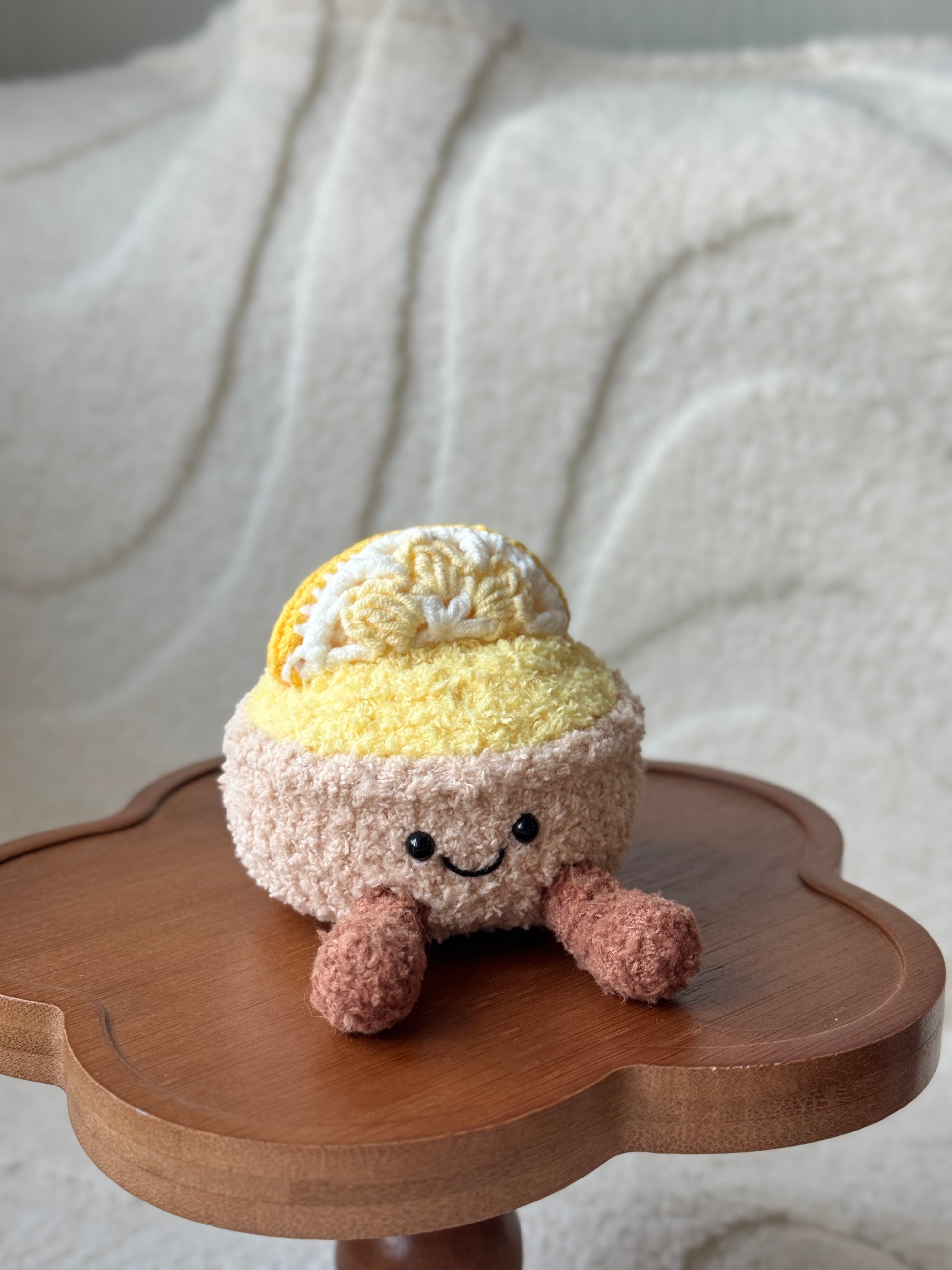 Lemon tart plush from the front with detailed view of smiling face and round legs.