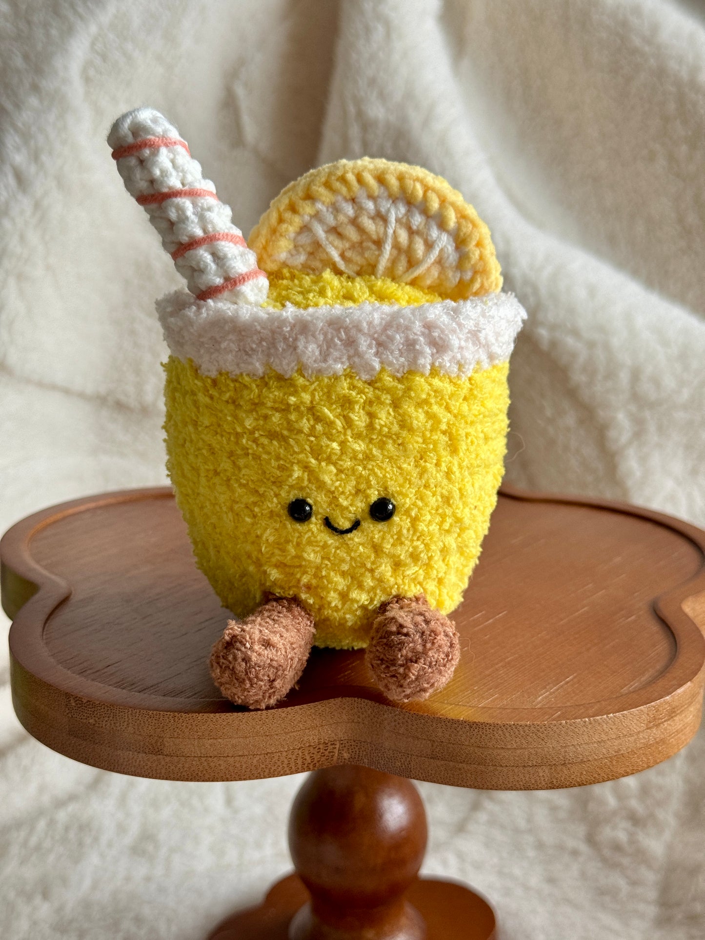 crochet lemonade plush with smiling face, swirled straw, and lemon slice – inspired by Jellycat summer drink toy