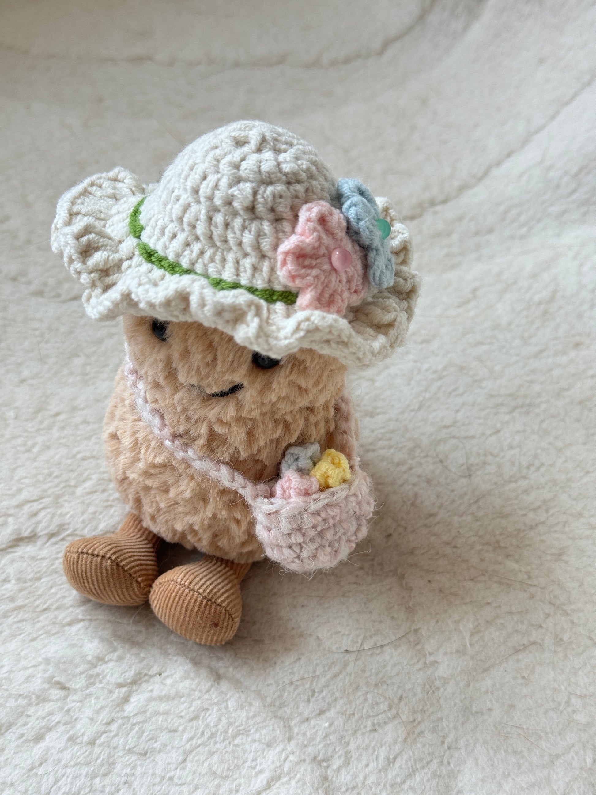 Handmade crochet accessories for Jellycat plush – close-up of ruffled sunhat and tiny bag.