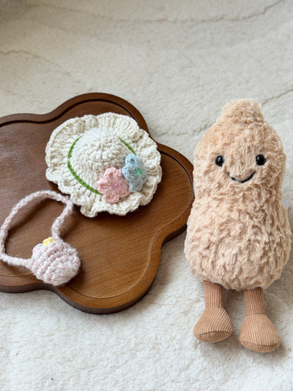 Plush toy outfit set displayed on wooden tray – includes mini flower bag and frilly sunhat.