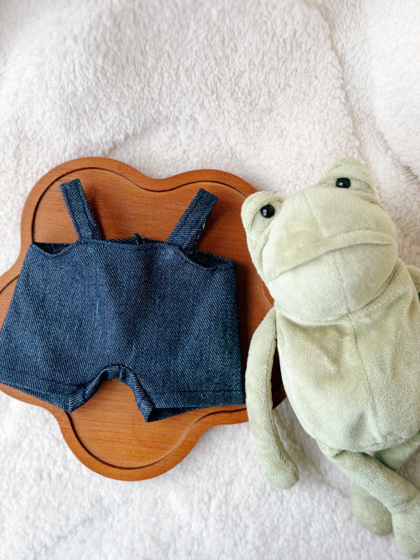 Handmade denim overalls outfit for Jellycat Fergus Frog plush displayed with frog toy