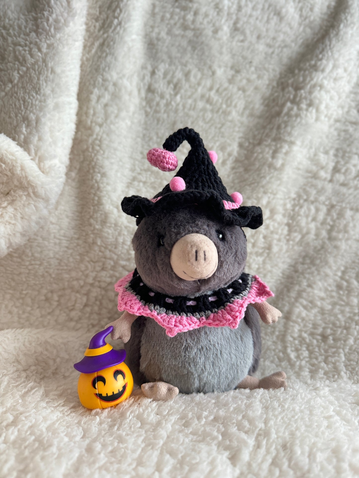 Jellycat Lolly the Sugar Glider wearing handmade black and pink witch costume with pumpkin prop