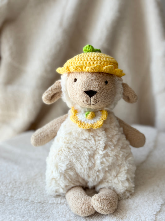 Jellycat Lollie Lamb wearing handmade yellow crochet lemon hat and matching bib outfit